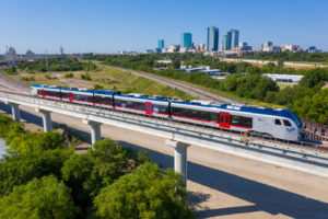 TEXRail Train riding on elevated track
