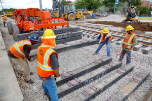 Construction workers working on the new train tracks in Grapevine, Texas