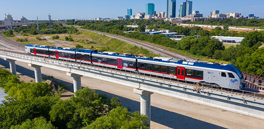 TEXRail train with downtown Fort Worth in background