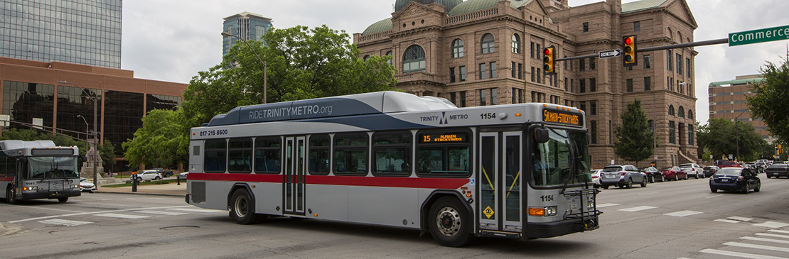 Trinity Metro bus driving by the courthouse in downtown Fort Worth