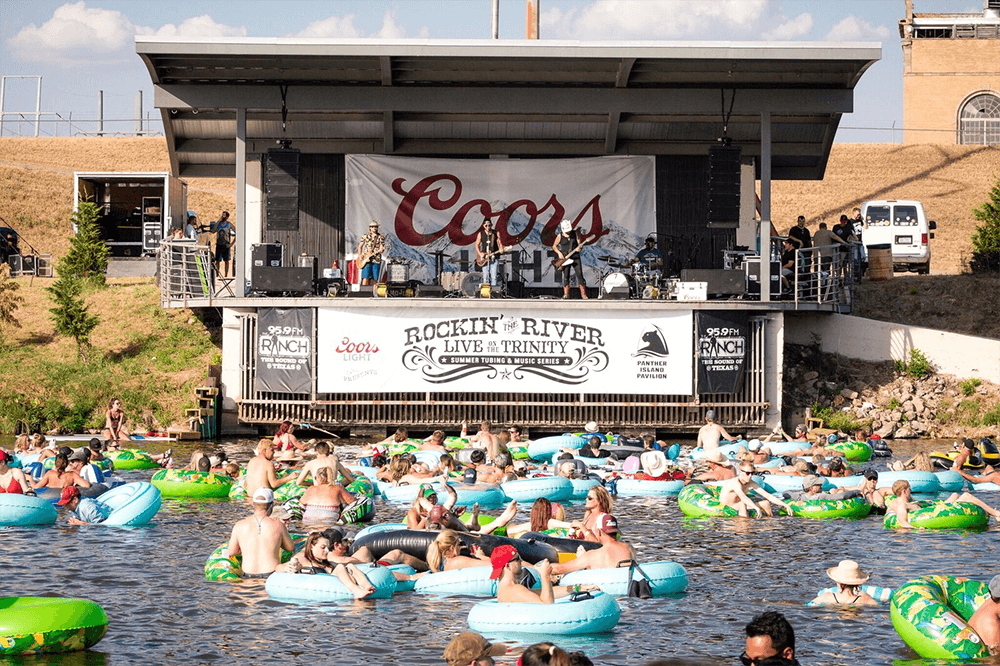 Tubing at Panther Island Pavilion People tubing on the trinity river in front of band at panther island pavilion